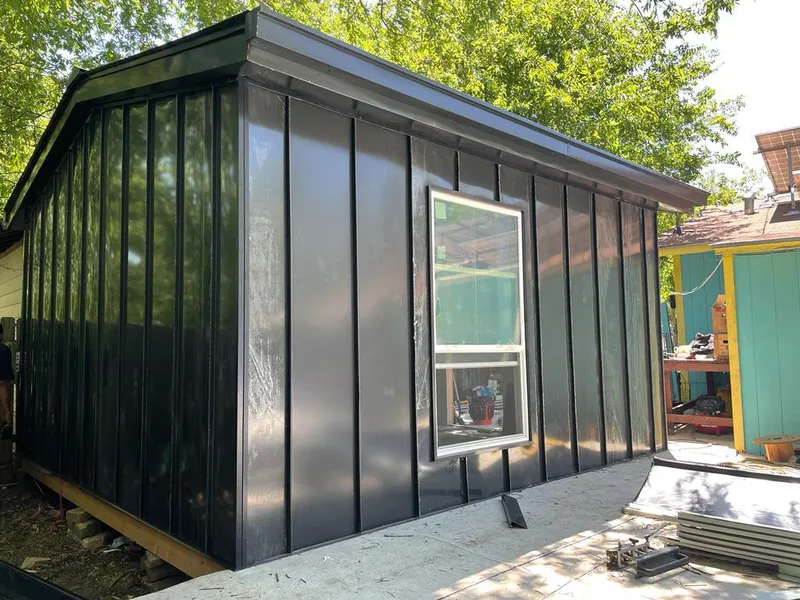 Black standing seam metal wall panels for Roof Inspection in Cambridge
