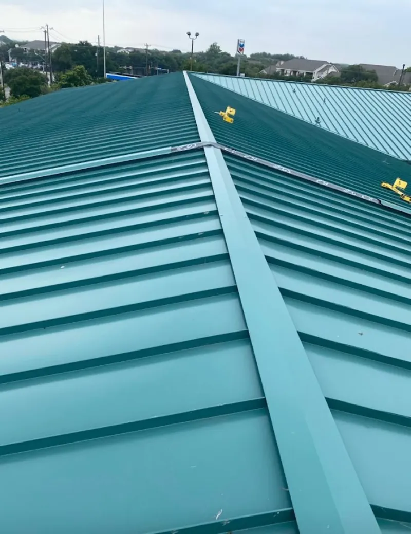 Green commercial metal roof ridge and valley for Metal Roof Repair in Cambridge